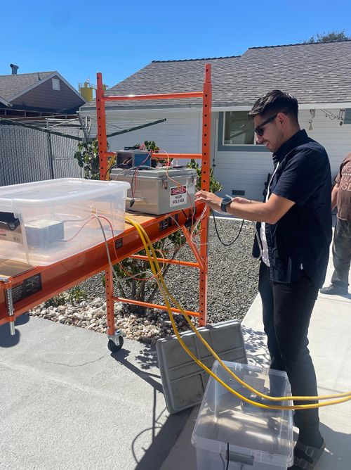 Alex Sanchez, UC Davis graduate student, helps set up a TARTA instrument at a home in Vallejo to detect and measure toxic metals in the air. Photo credit: Alex Sanchez, UC Davis
